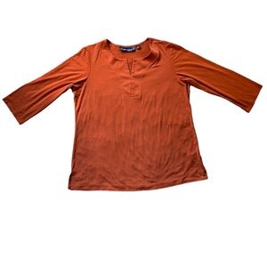 Susan Graver burnt orange top with slip tv neck and bracelet length sleeves